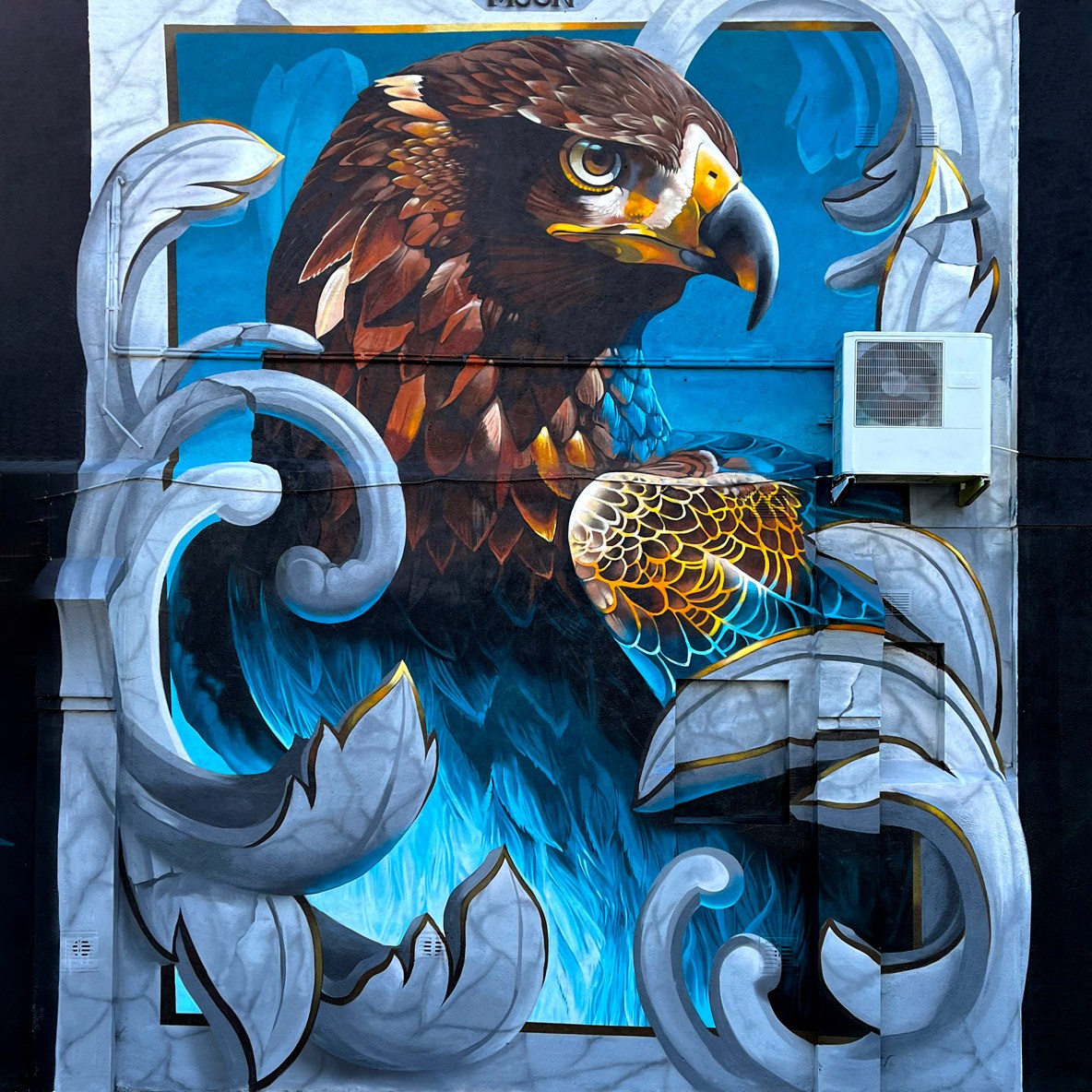 large street art mural of an eagle and filigree on a wall in Southend on Sea by tech moon for Southend City Jam