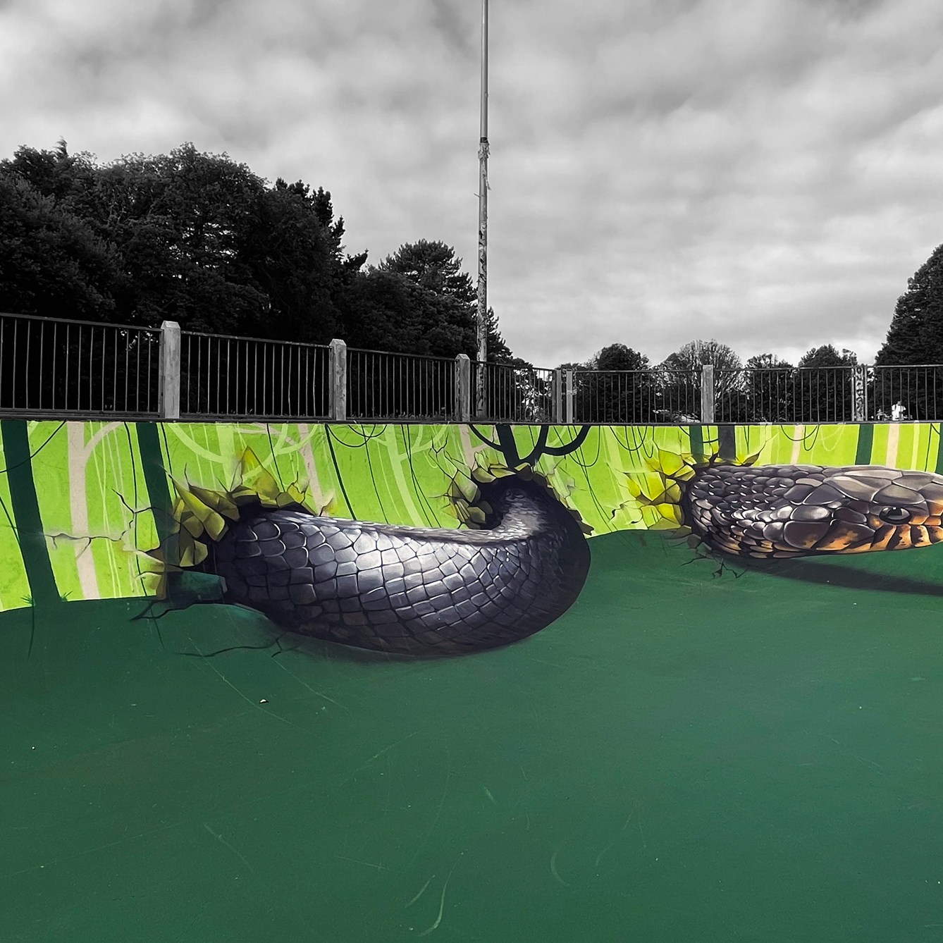 Anamorphic street art mural of a snake. Trompe l'oeil by Tech Moon
